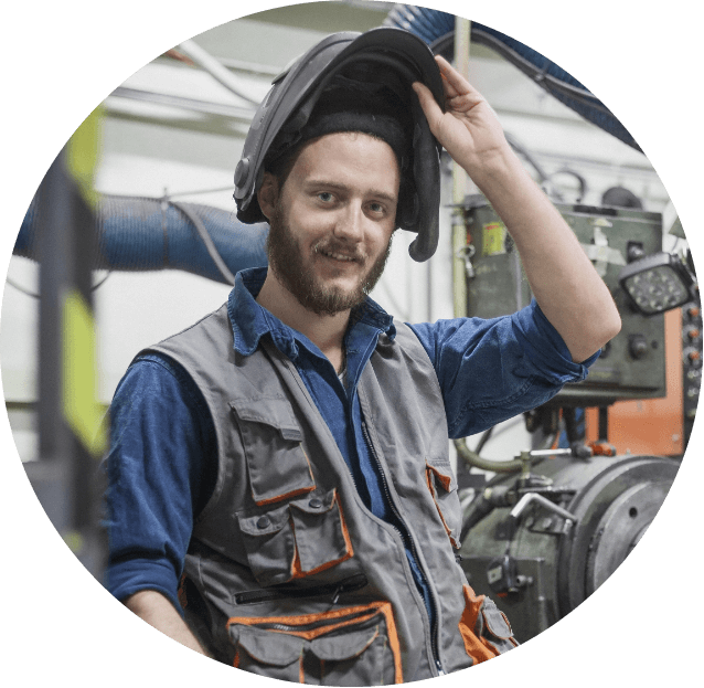 man in work vest and flipping up his welding mask